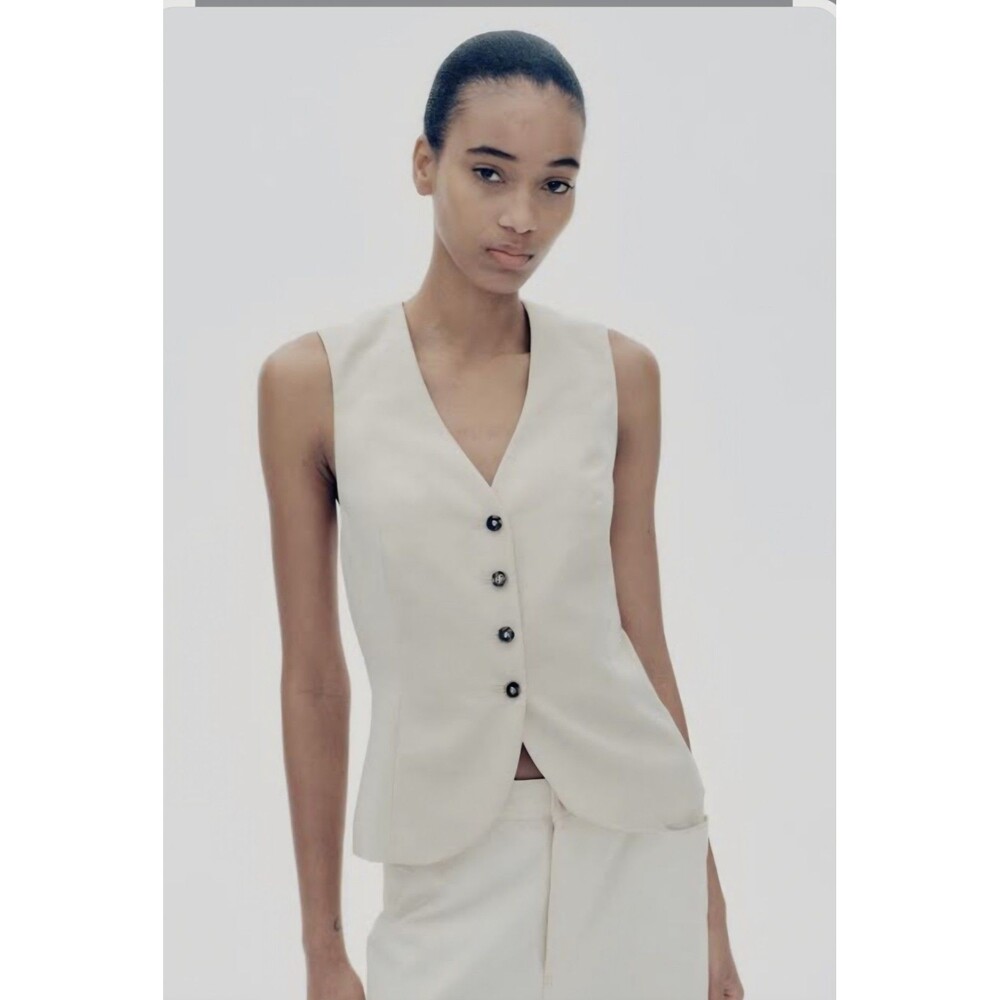 H&M women's linen tailored vest, elegant for any occasion.